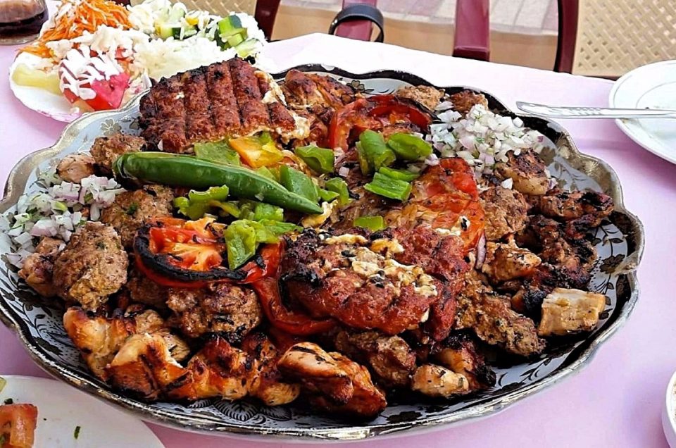 A platter heaped with a variety of grilled meats as served during a Casablanca food tour.